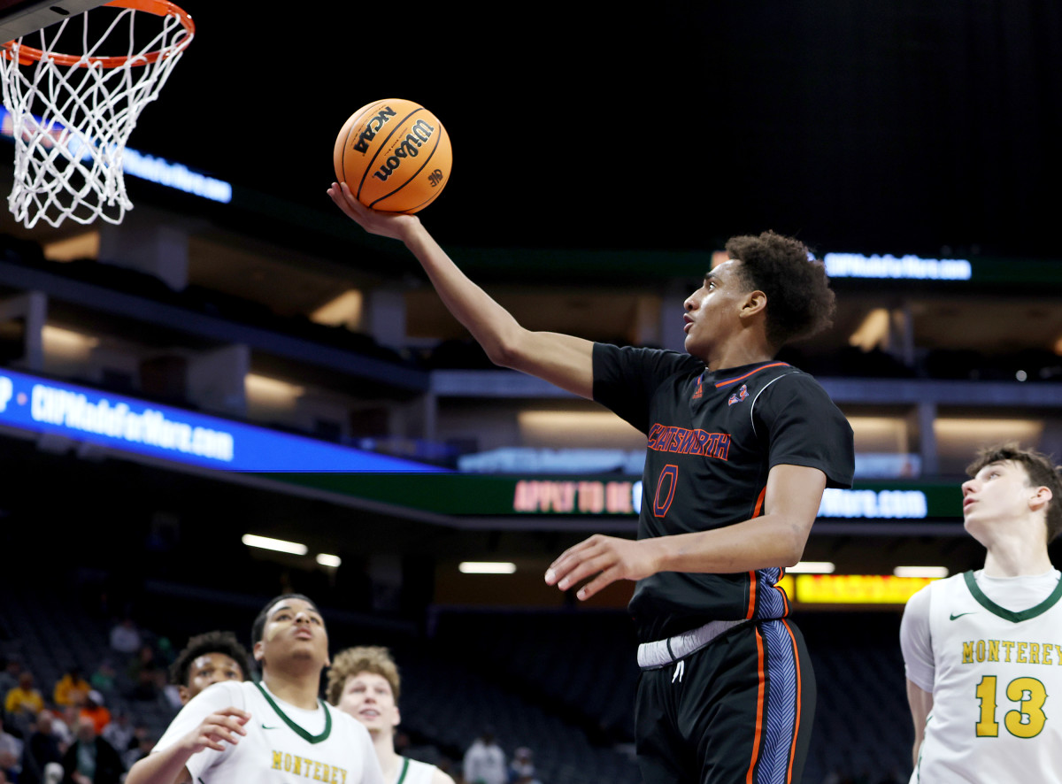 Alijah Arenas goes in for two of his record 44 points. 